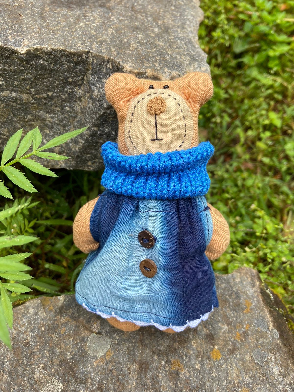 Stuffed bear in a frock